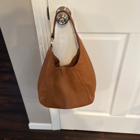 Michael Kors tan leather purse. Gold emblem. Gently used
Snap closure dust bag - Picture 8 of 9